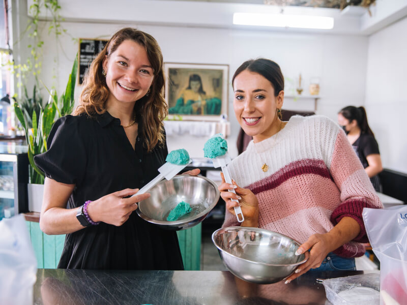 two girls at a macaron baking class